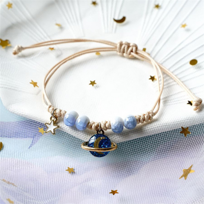 bracelet saturne de couleur blanc et bleu