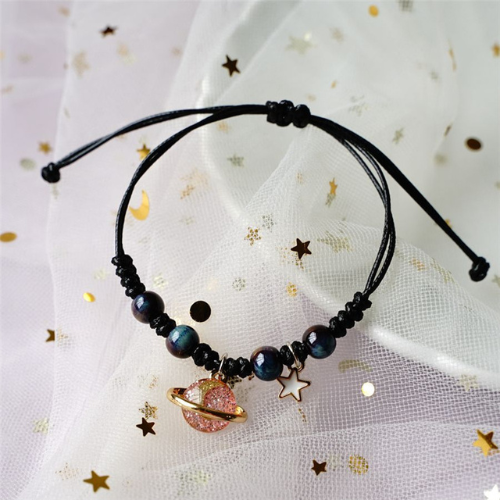 bracelet saturne de couleur noir et rose